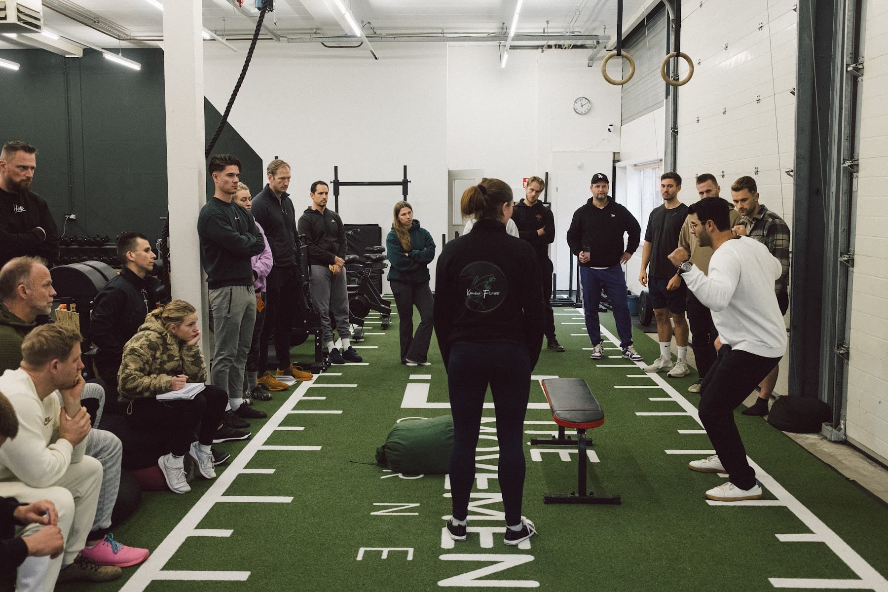 Coaches watching a live movement assessment demonstration