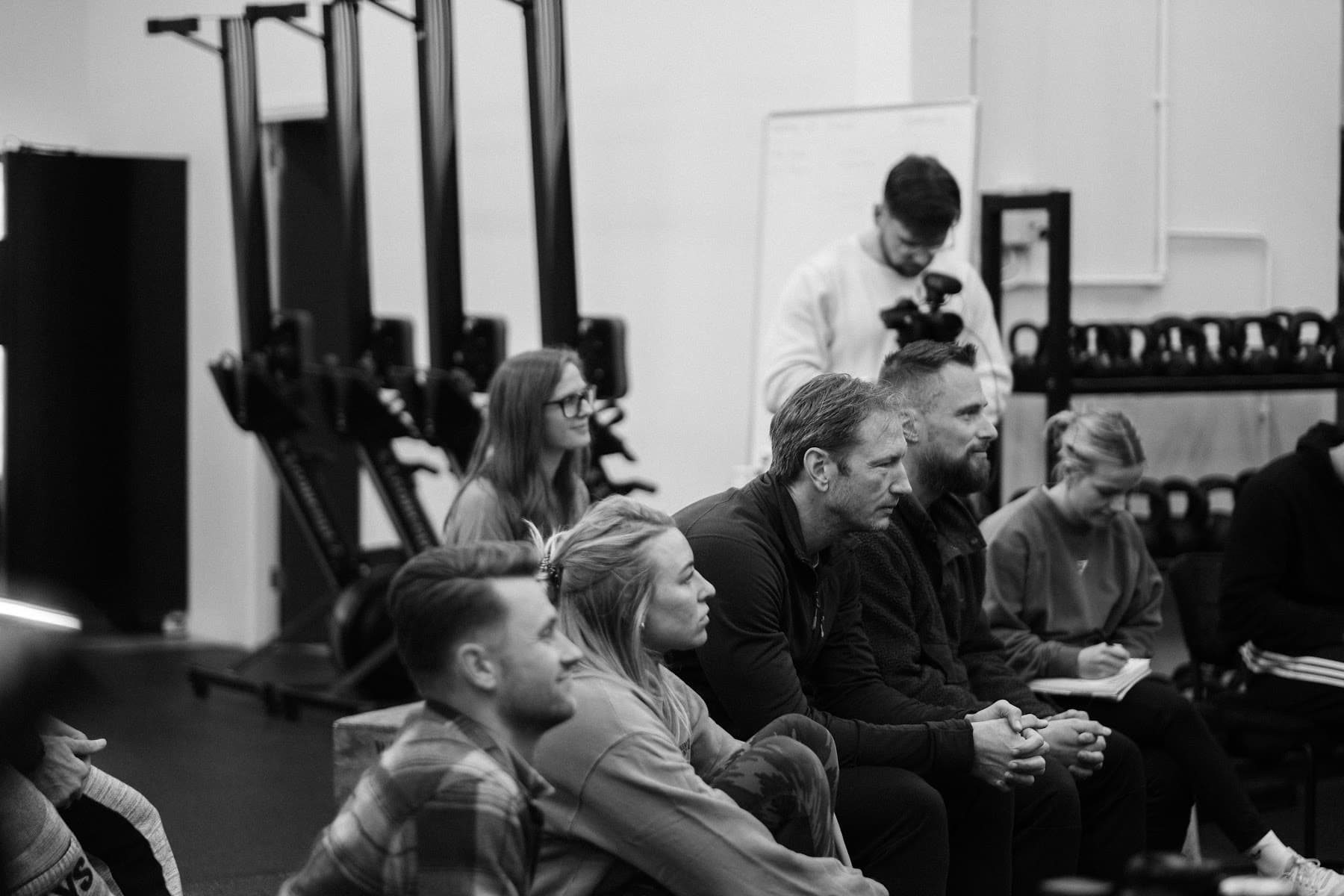 Coaches listening during a Moved Academy workshop
