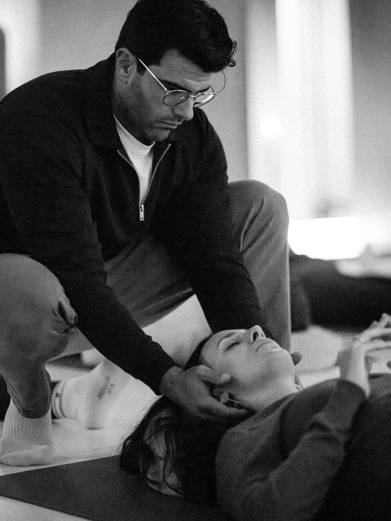 Richard Aceves guiding hands-on nervous system work with a coach